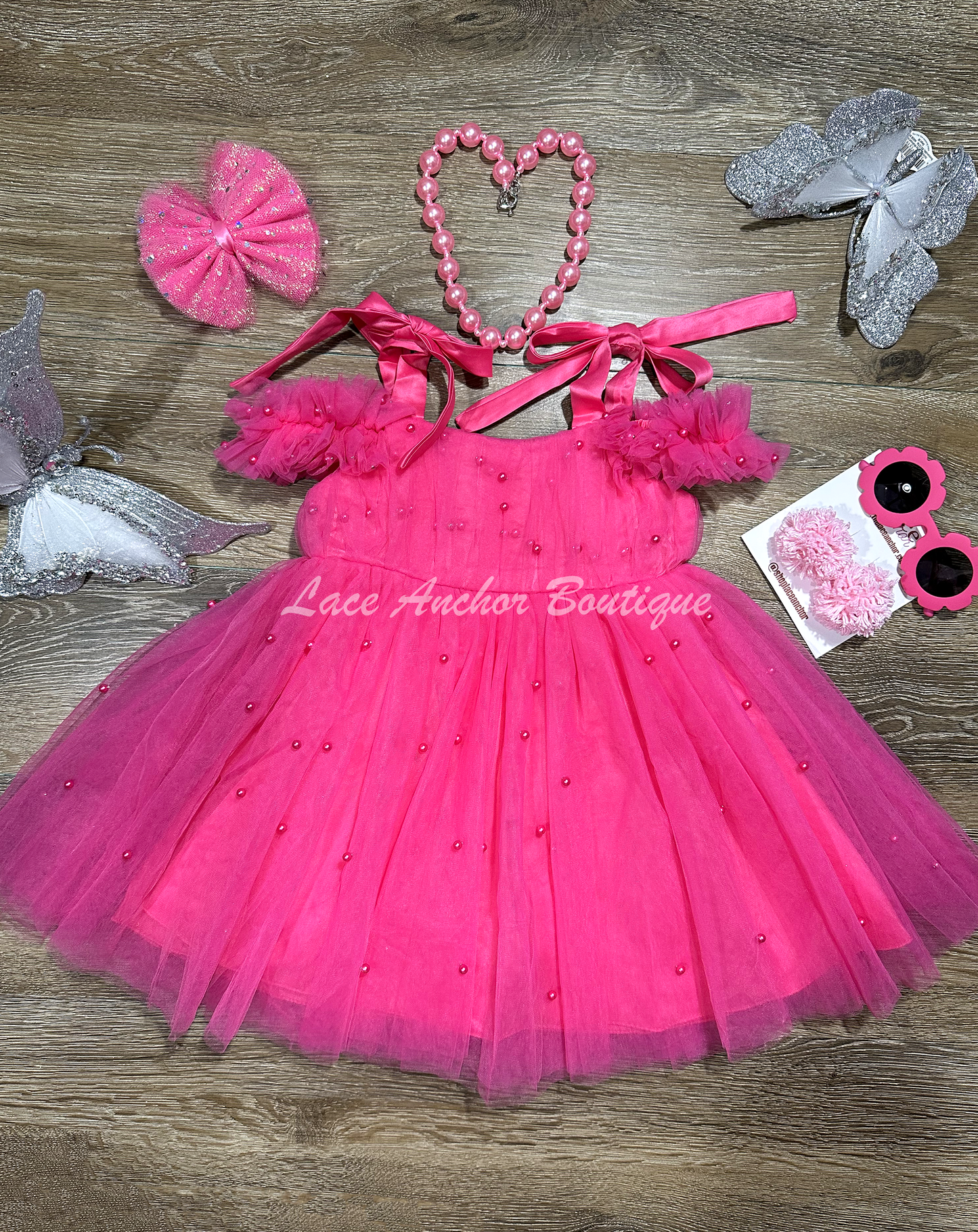 hot pink tulle princess birthday girl dress with pink pearls and bow tied shoulders with ruffled off shoulder sleeves. Baby toddler youth girls tutu party dress.