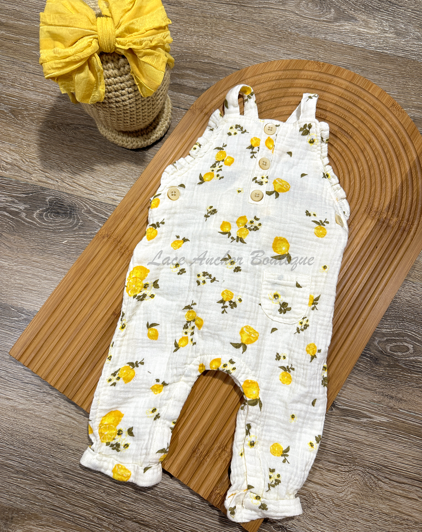 linen baby girls romper with lemon and branch print with buttons and ruffles