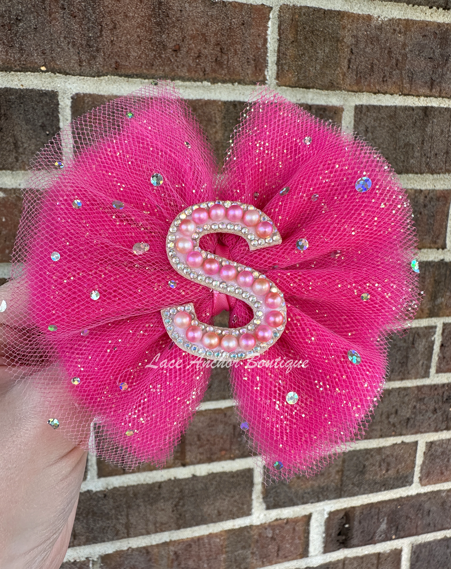 hot pink glitter hair bow for girls. Clip bows with rhinestone and pearl custom name letter.