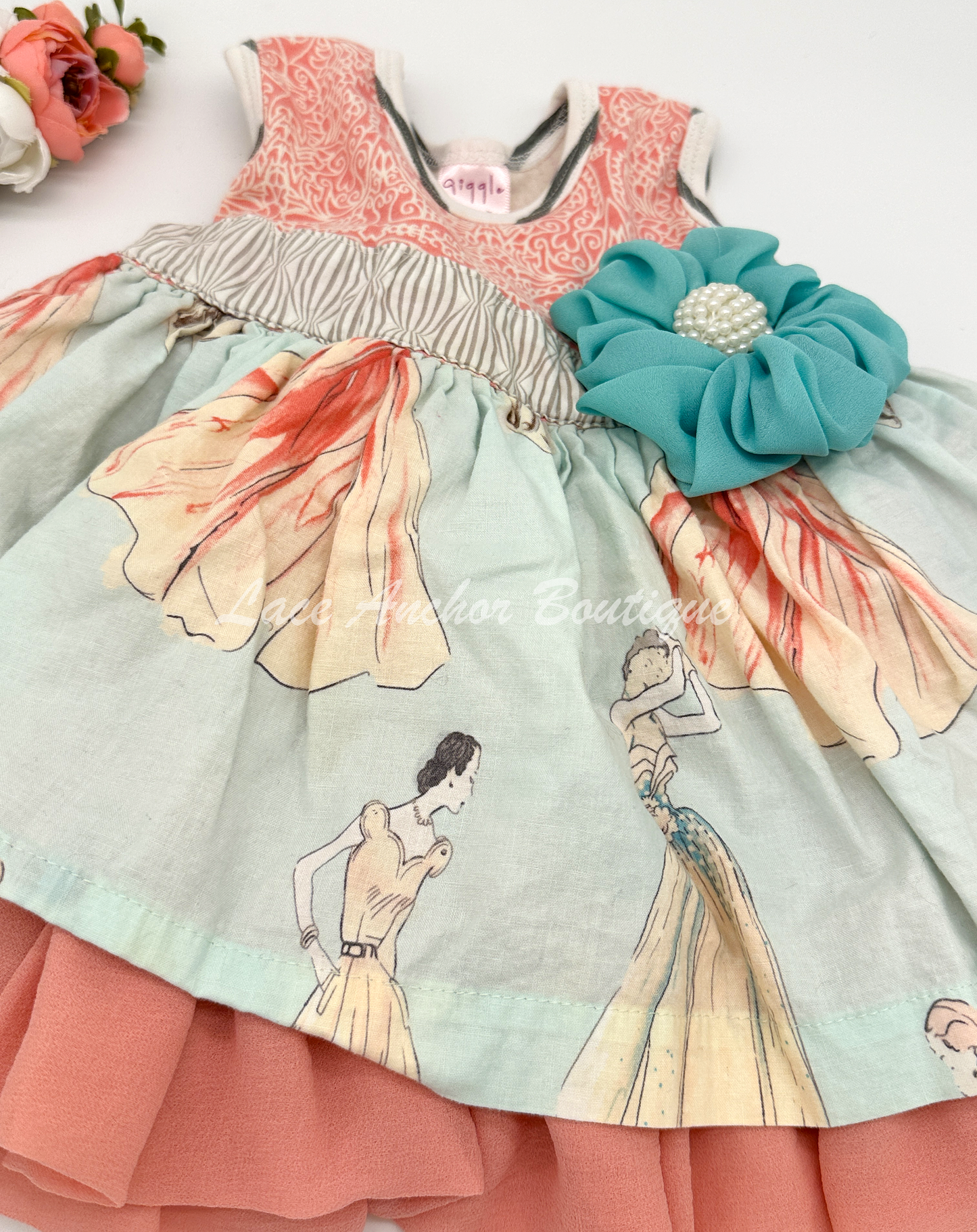 Vintage lady print baby girls dress in coral and blue with flower on waist
