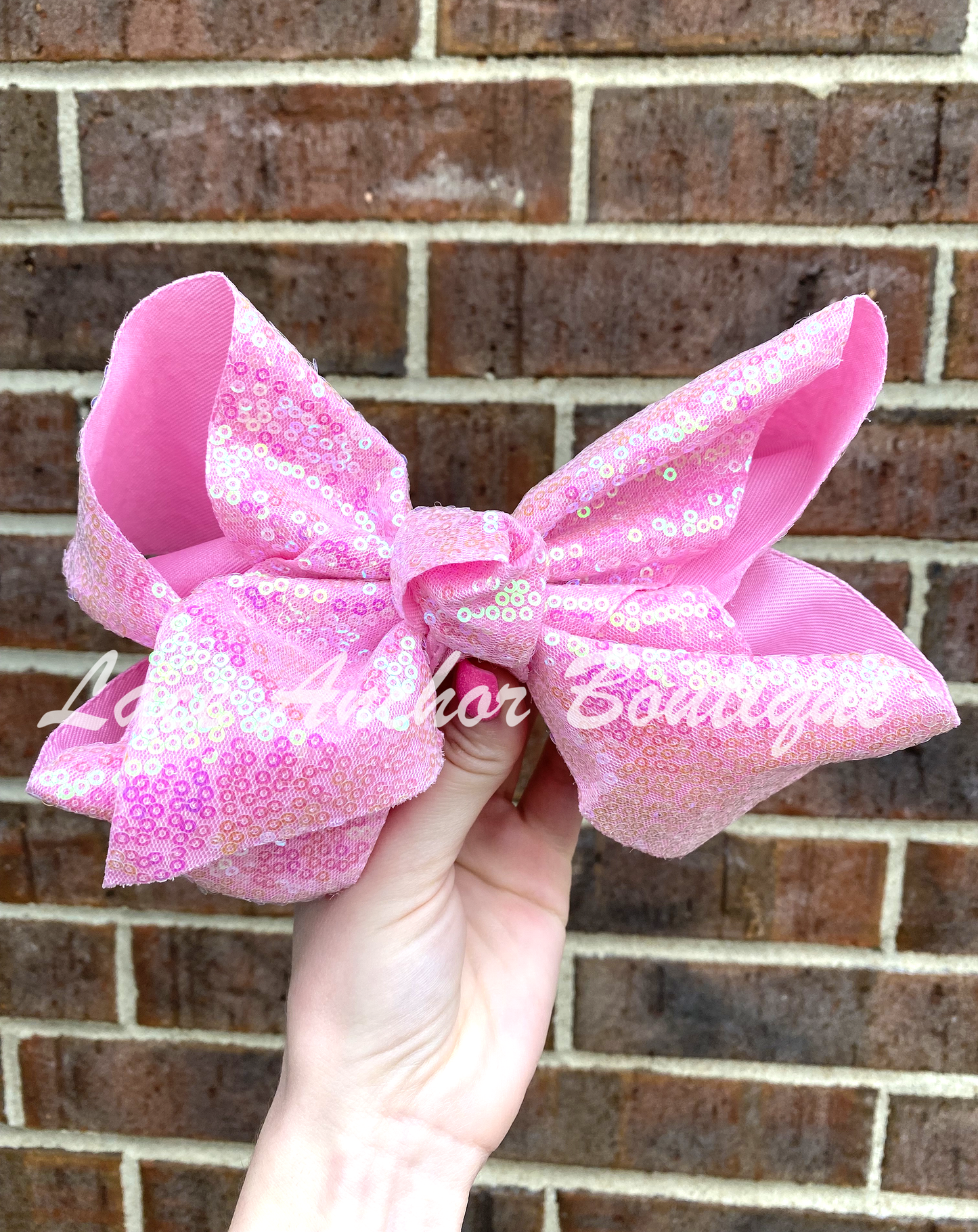 jumbo size girls ribbon bows covered in sequins in light pink