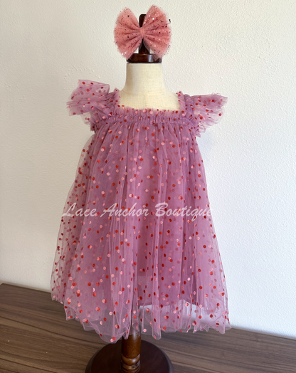 plum purple tulle tutu girls dress with glitter pink and red polka dots and ruffled sleeves.