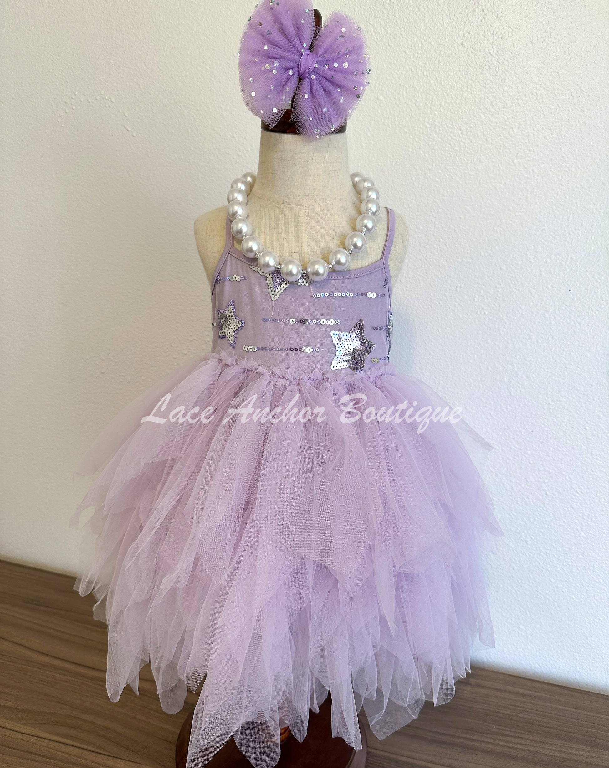 lilac purple toddler youth girls dress with silver sequin stars on top, thin straps, and messy fringed layered tulle skirt. Girl princes dress.