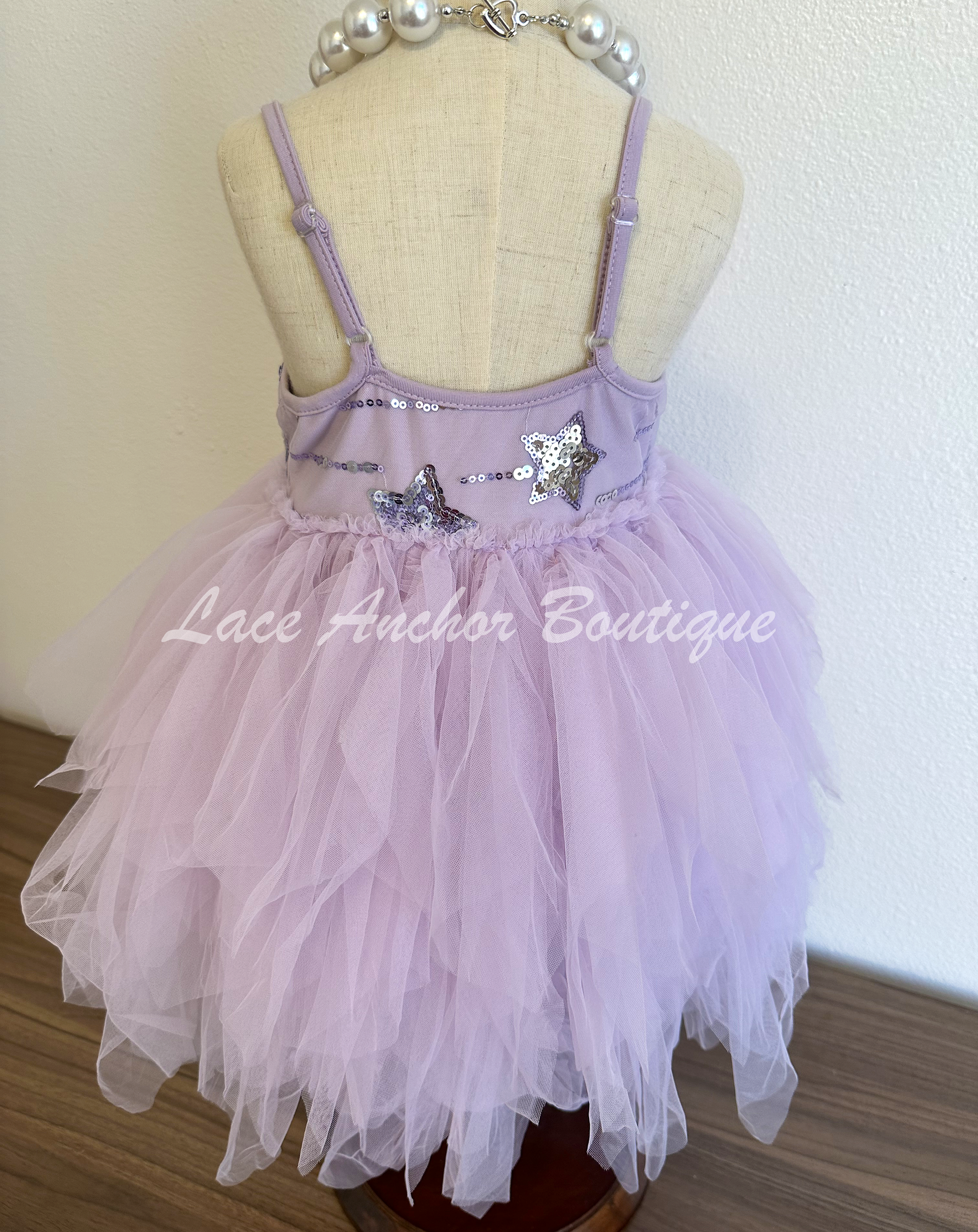 lilac purple toddler youth girls dress with silver sequin stars on top, thin straps, and messy fringed layered tulle skirt. Girl princes dress.
