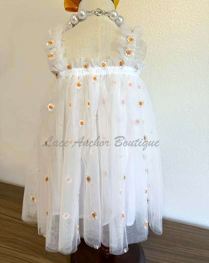 Toddler baby girls white tulle dress with white and orange daisies. daisy flower print ruffled baby girls flower girl dress.