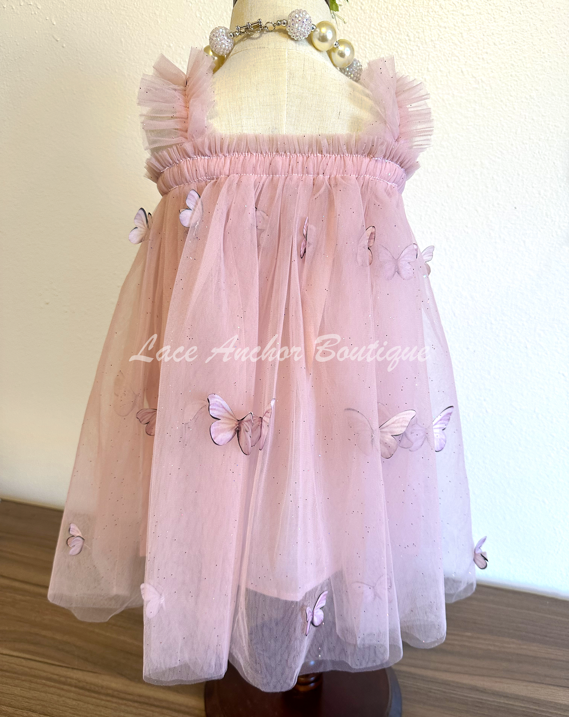 Mauve pink tulle girls dress with realistic butterflies and glitter fabric with ruffle straps