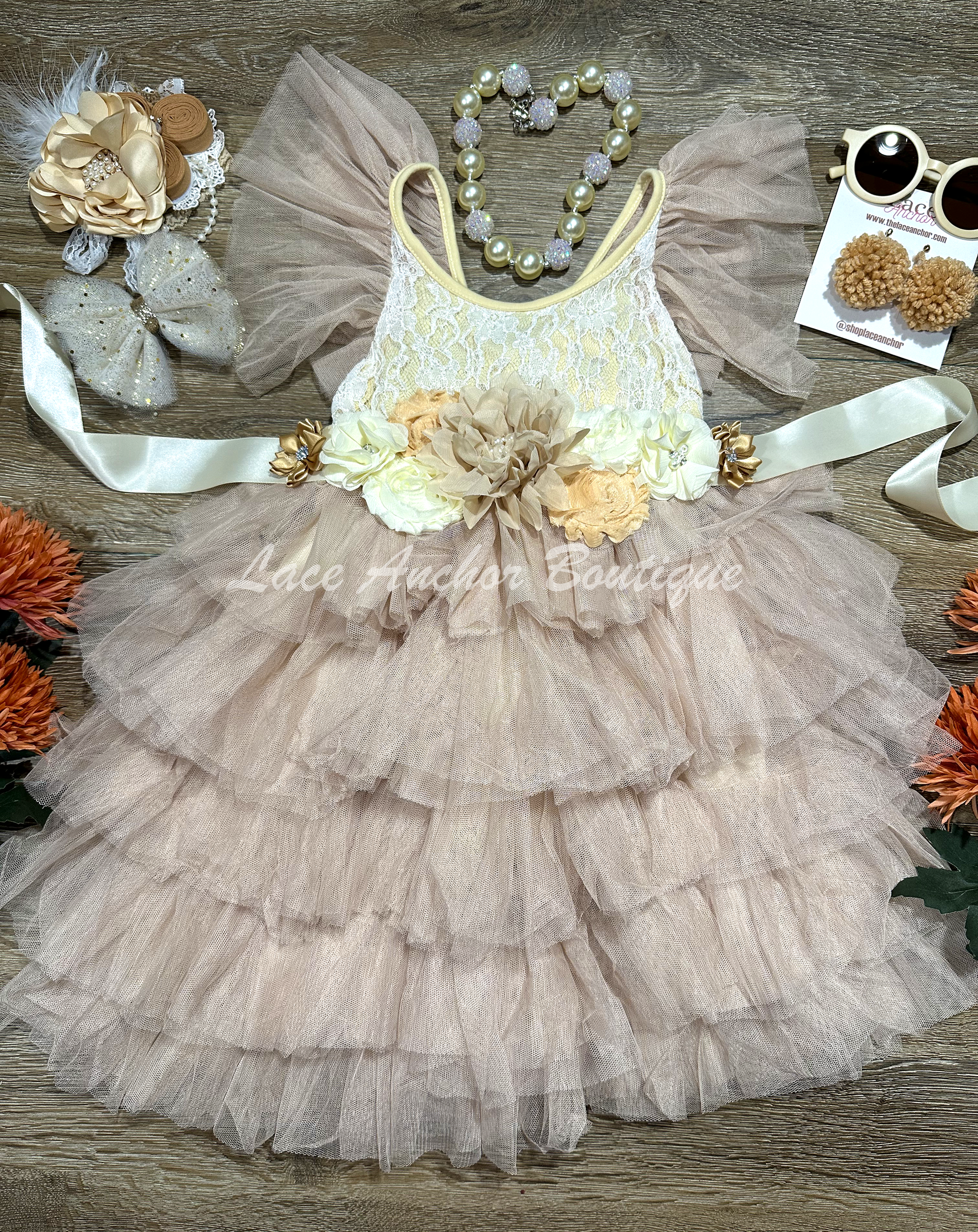 taupe, beige, white girls lace tiered ruffle maxi dress, tulle sleeves, and tied floral flower sash. Spring flower girl dress.