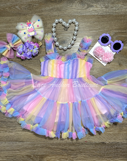 toddler youth girls pastel rainbow multi colored dress with pearl details and ruffle trim and straps. Unicorn colored theme birthday girl princess dress.