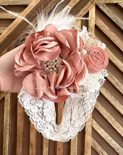floral rhinestone, pearl, burlap, feather, and lace baby girls headband wrap. Flower girl elegant toddler hair bow in mauve pink.