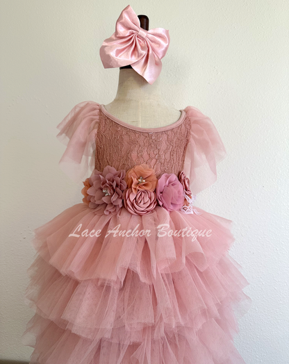 mauve pink girls lace tiered ruffle maxi dress, tulle sleeves, and tied floral flower sash. Spring flower girl dress.