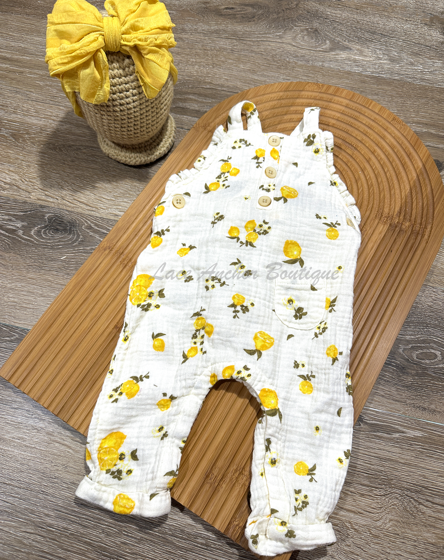 linen baby girls romper with lemon and branch print with  buttons and ruffles