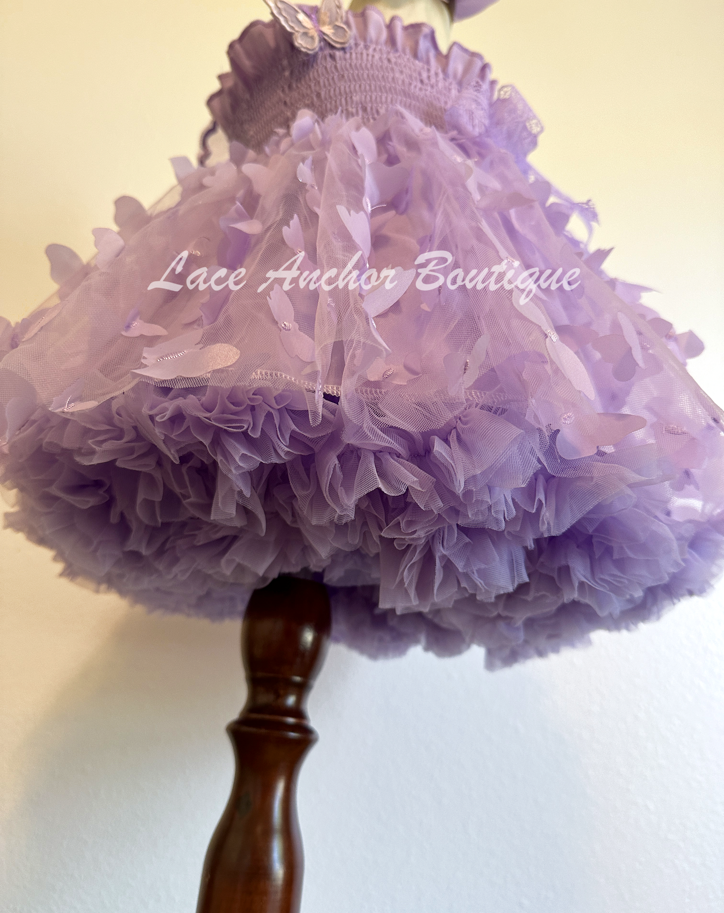 lilac purple girls butterfly wing fairy dress in pink on model child toddler. Has butterflies all over skirt.