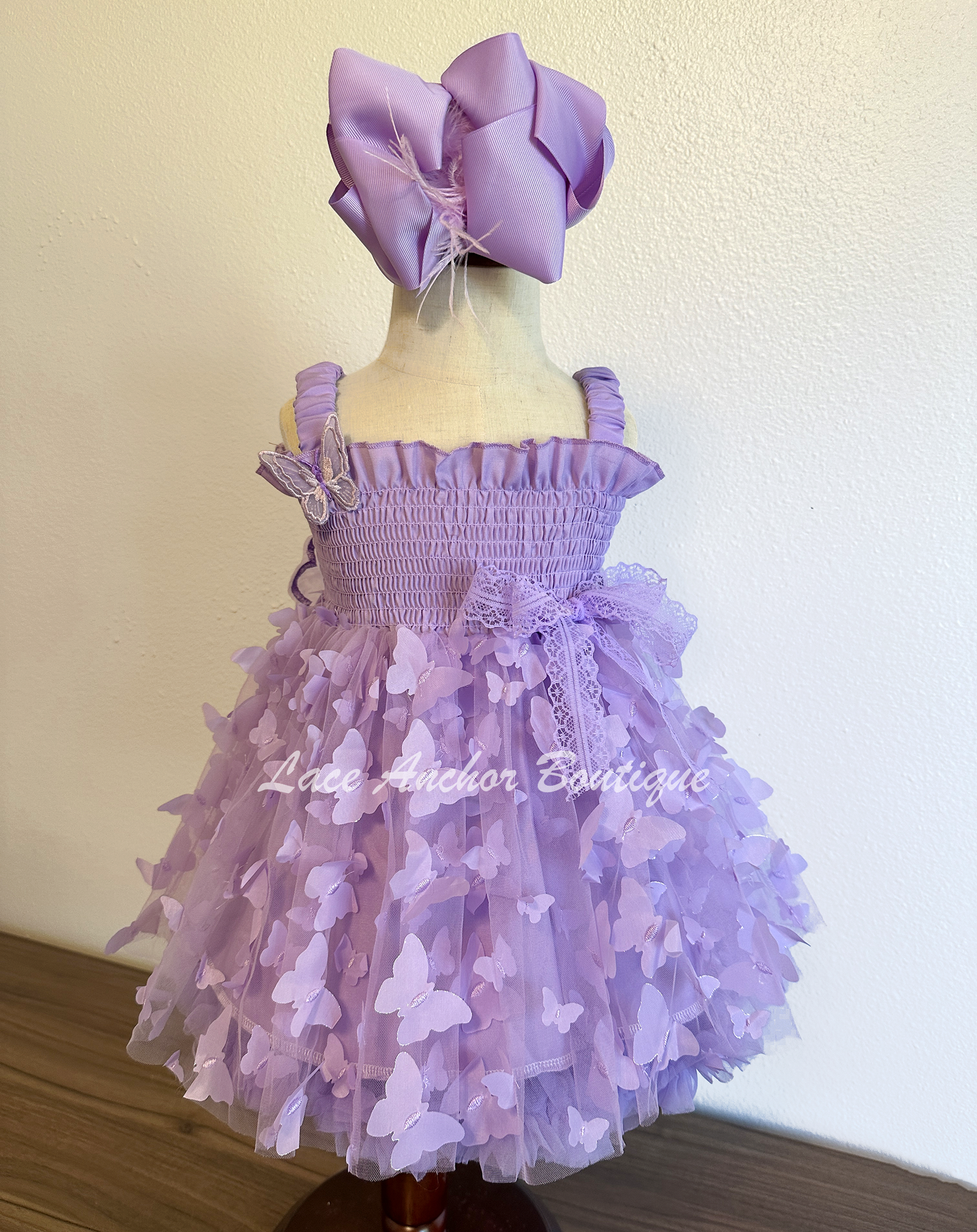 lilac purple girls butterfly wing fairy dress in pink on model child toddler. Has butterflies all over skirt.