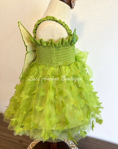 lime bright green girls butterfly wing fairy dress in pink on model child toddler. Has butterflies all over skirt.