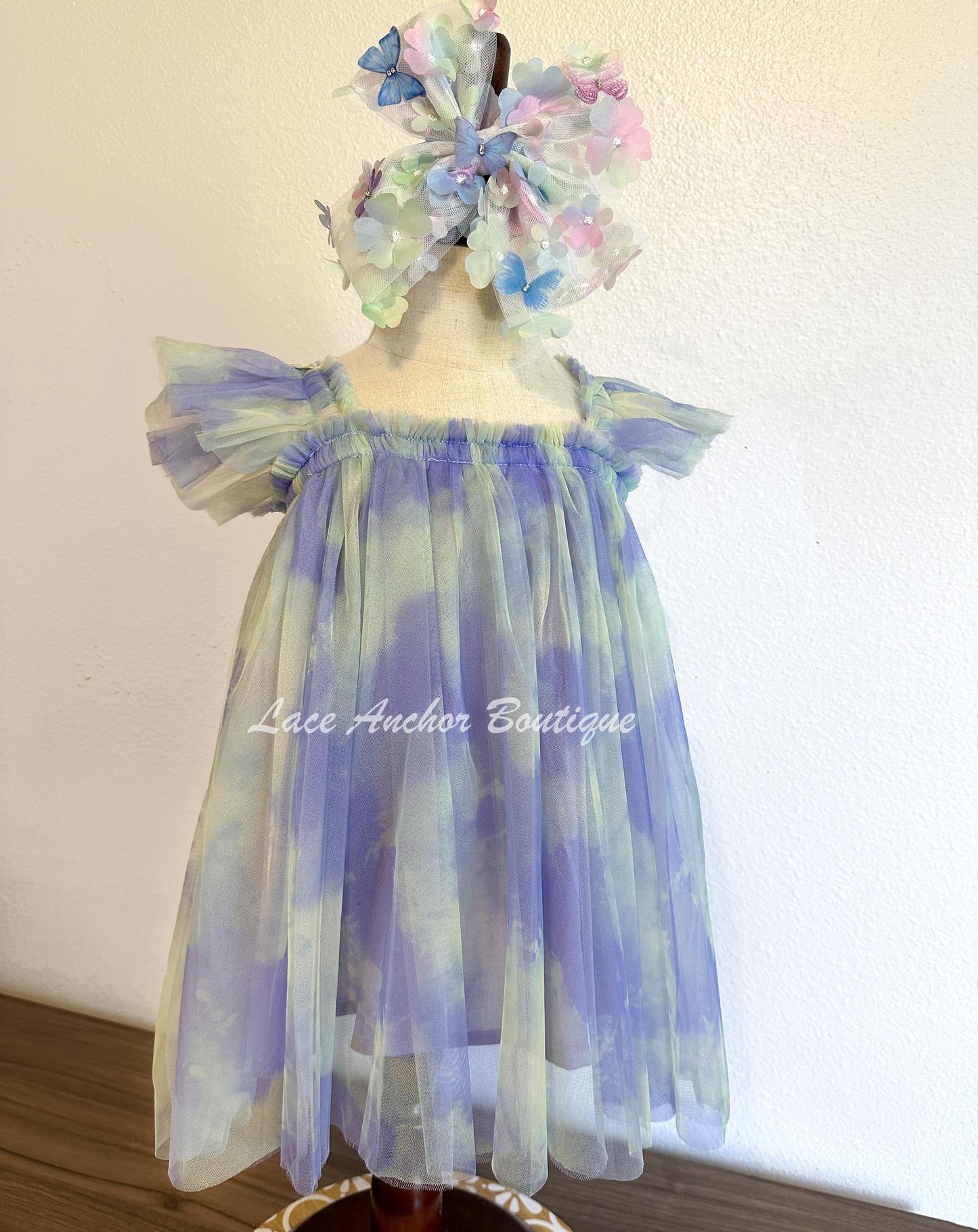 Rainbow fairy knee length tulle dresses with iridescent butterfly wings attached for toddlers, babies, kids. Dress for girls.