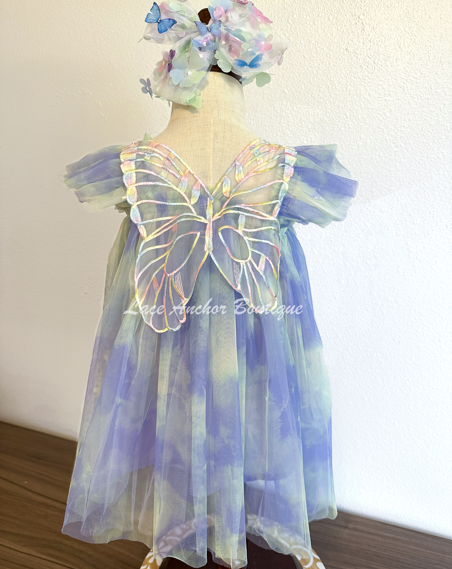 Rainbow fairy knee length tulle dresses with iridescent butterfly wings attached for toddlers, babies, kids. Dress for girls.