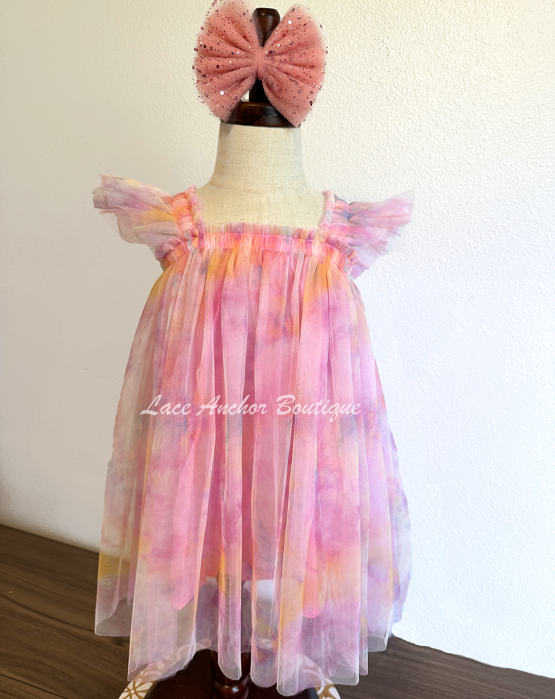 Rainbow fairy knee length tulle dresses with iridescent butterfly wings attached for toddlers, babies, kids. Dress for girls.