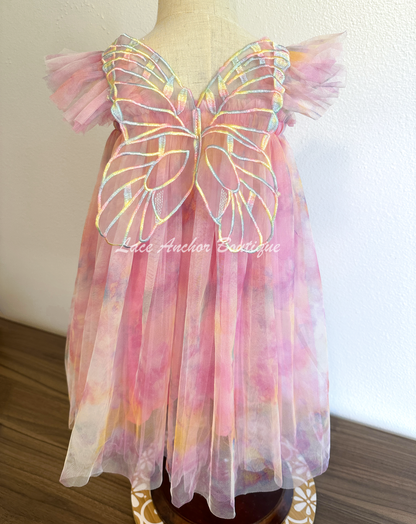 Rainbow fairy knee length tulle dresses with iridescent butterfly wings attached for toddlers, babies, kids. Dress for girls.