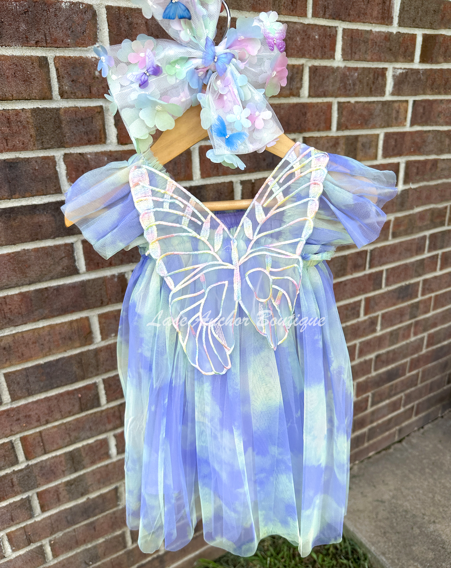 Rainbow fairy knee length tulle dresses with iridescent butterfly wings attached for toddlers, babies, kids. Dress for girls.