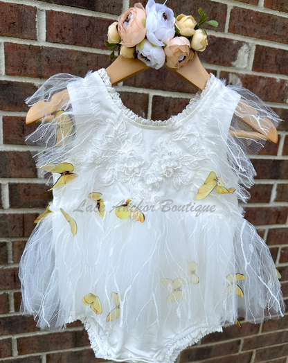 white baby girls romper with floral embroidery, tulle, lace, and butterflies all over