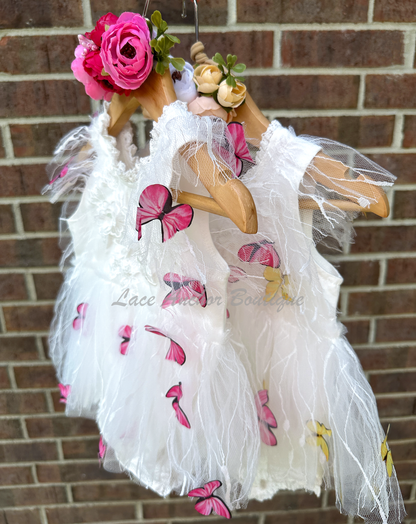 white baby girls romper with floral embroidery, tulle, lace, and butterflies all over