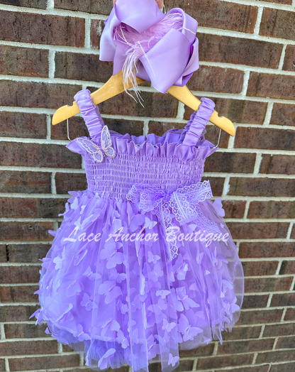 lilac purple girls butterfly wing fairy dress in pink on model child toddler. Has butterflies all over skirt.