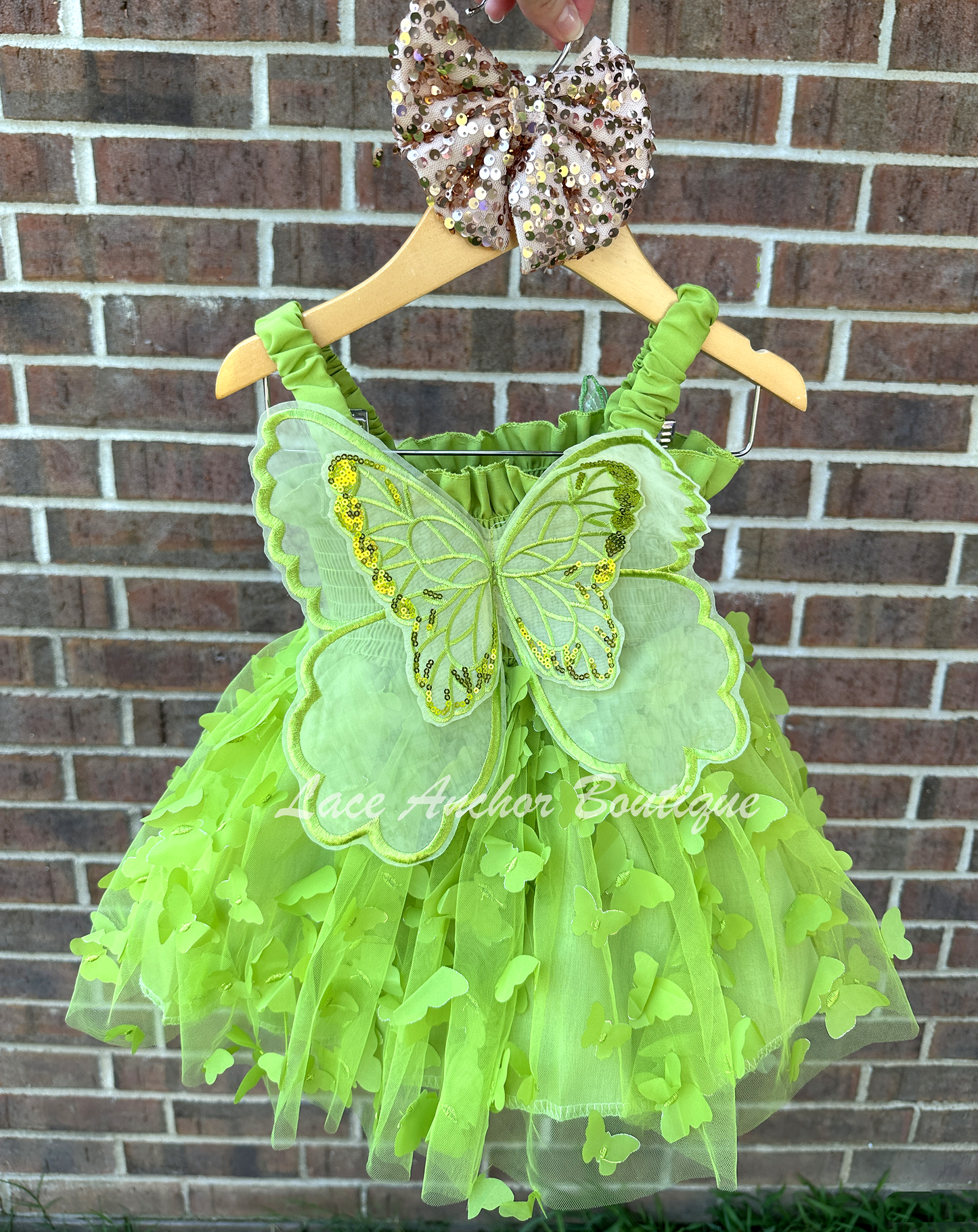 lime bright green girls butterfly wing fairy dress in pink on model child toddler. Has butterflies all over skirt.