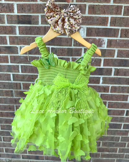 lime bright green girls butterfly wing fairy dress in pink on model child toddler. Has butterflies all over skirt.