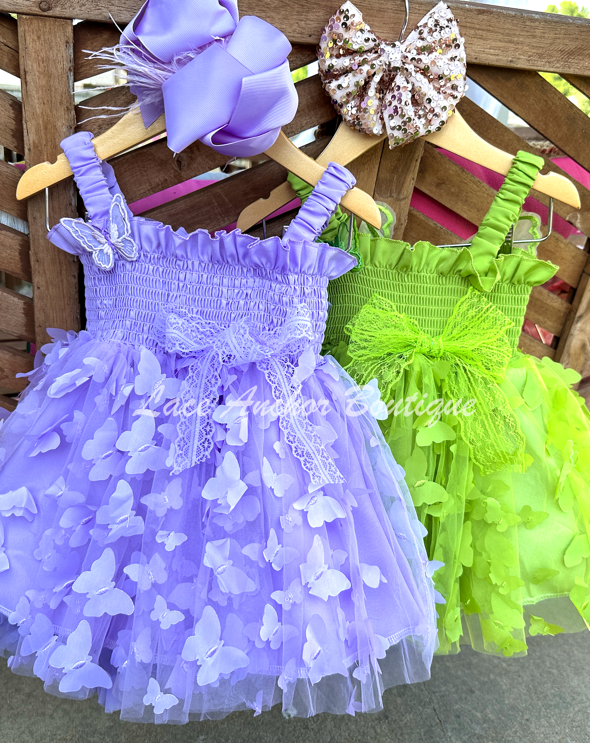 lilac purple or lime bright green girls butterfly wing fairy dress in pink on model child toddler. Has butterflies all over skirt.