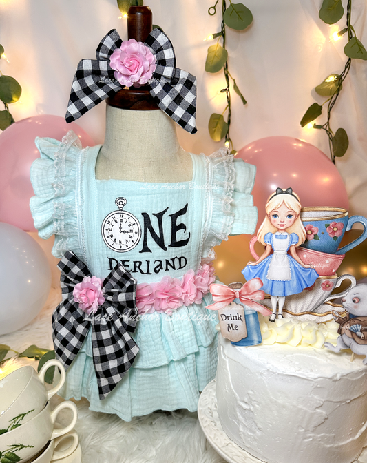 Alice in Onederland (Wonderland) themed baby girls blue romper set with gingham bow, pink flowers, and bow on nylon.