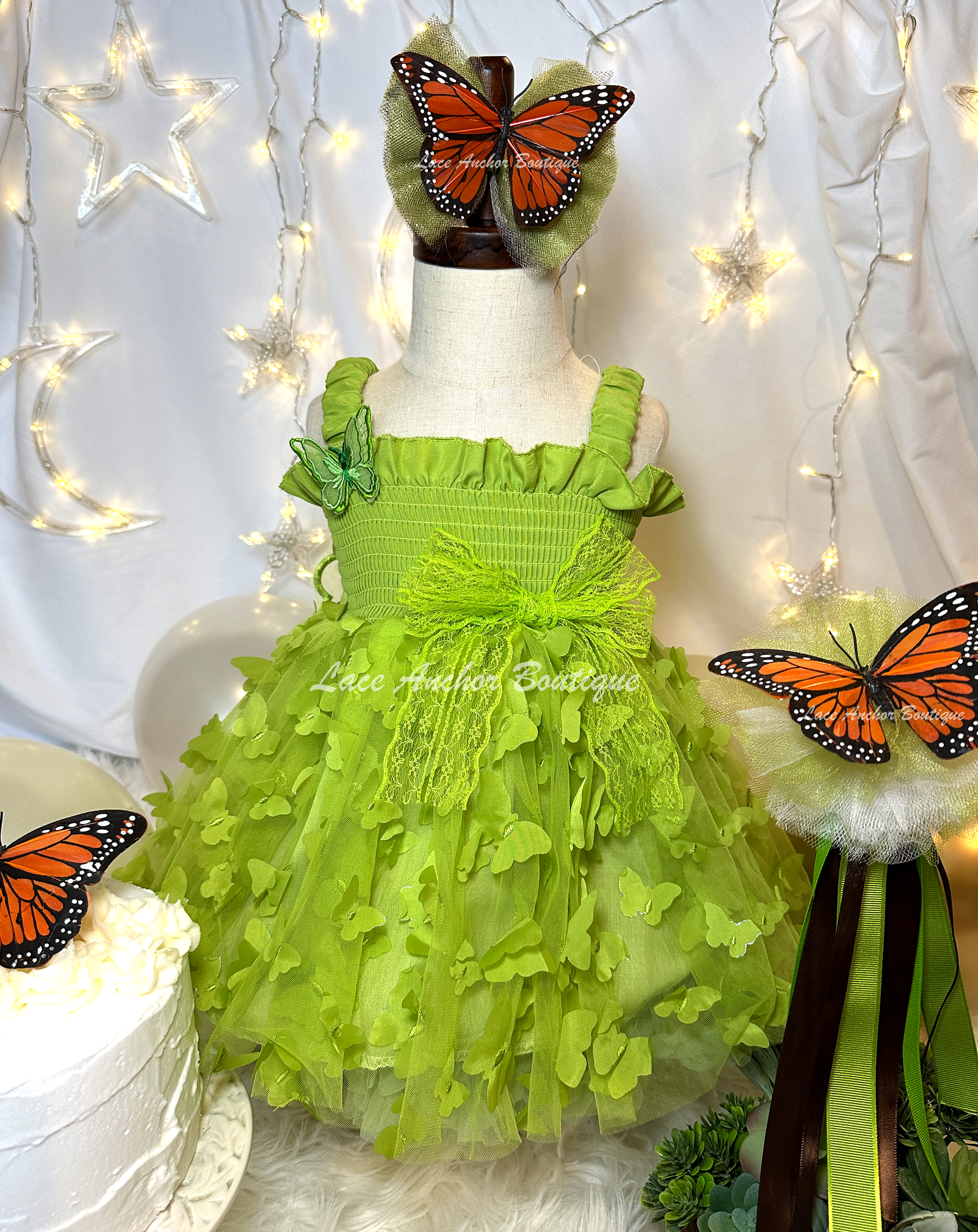 lime bright green girls butterfly wing fairy dress in pink on model child toddler. Has butterflies all over skirt.