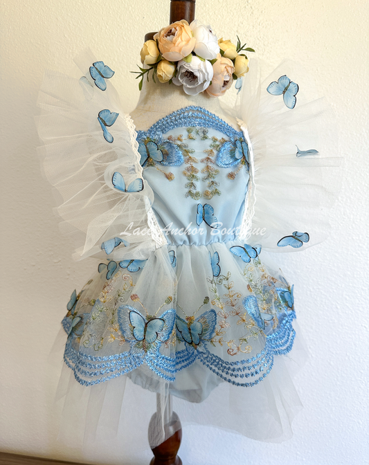 baby girls romper with flutter sleeves and skirt. Made of tulle with embroidered floral design and matching realistic butterflies all over in light blue.