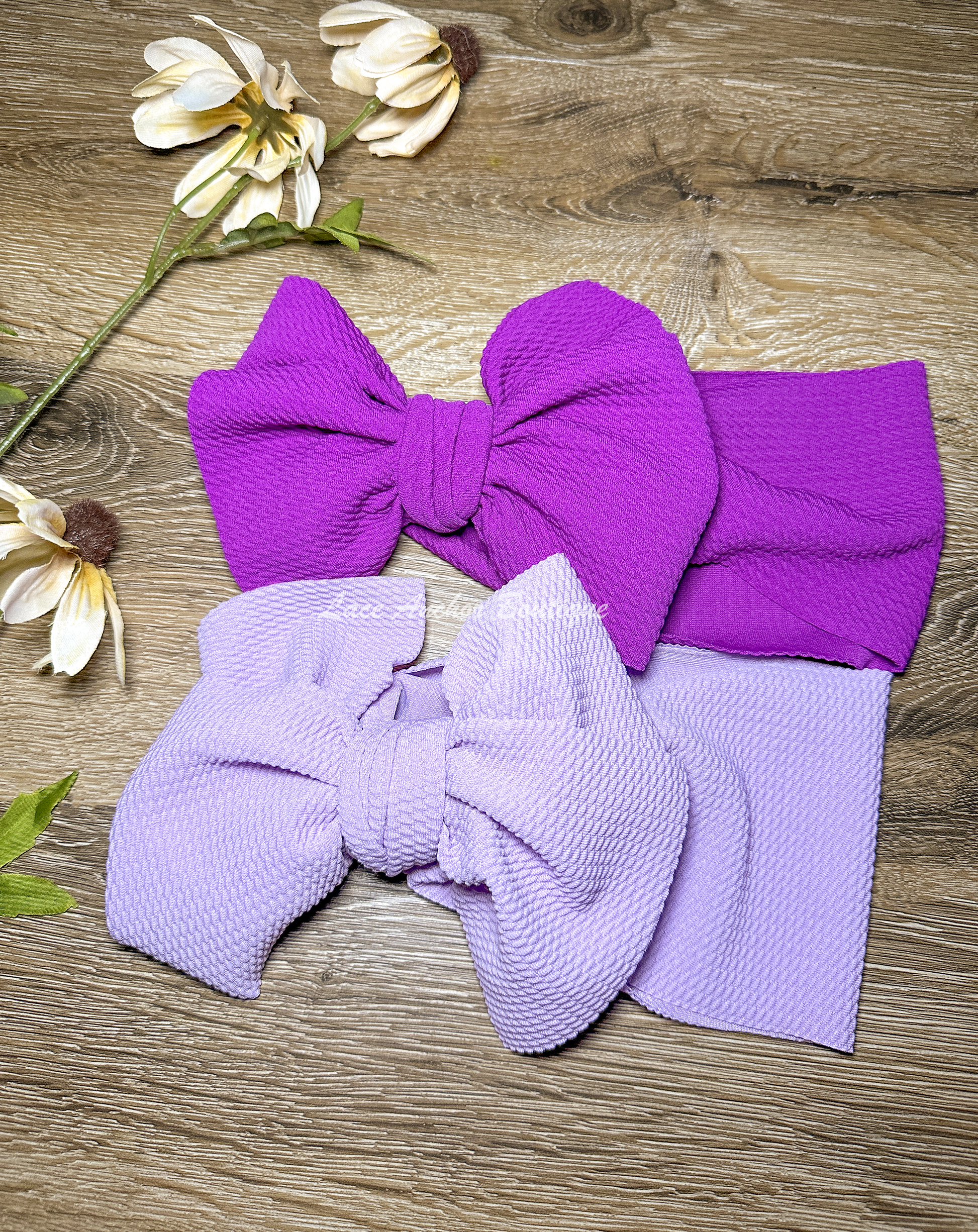 bullet fabric baby girl wrap style hair bows in bright purple and lilac purple