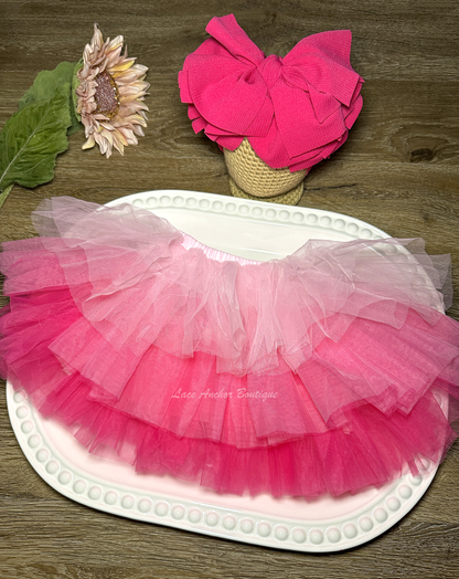 three colored pink tulle tutu with layers of ruffles