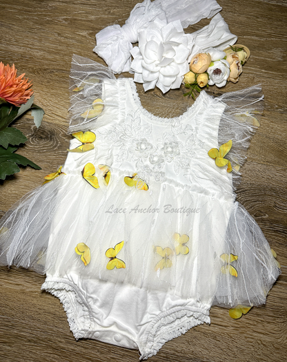 white baby girls romper with floral embroidery, tulle, lace, and butterflies all over