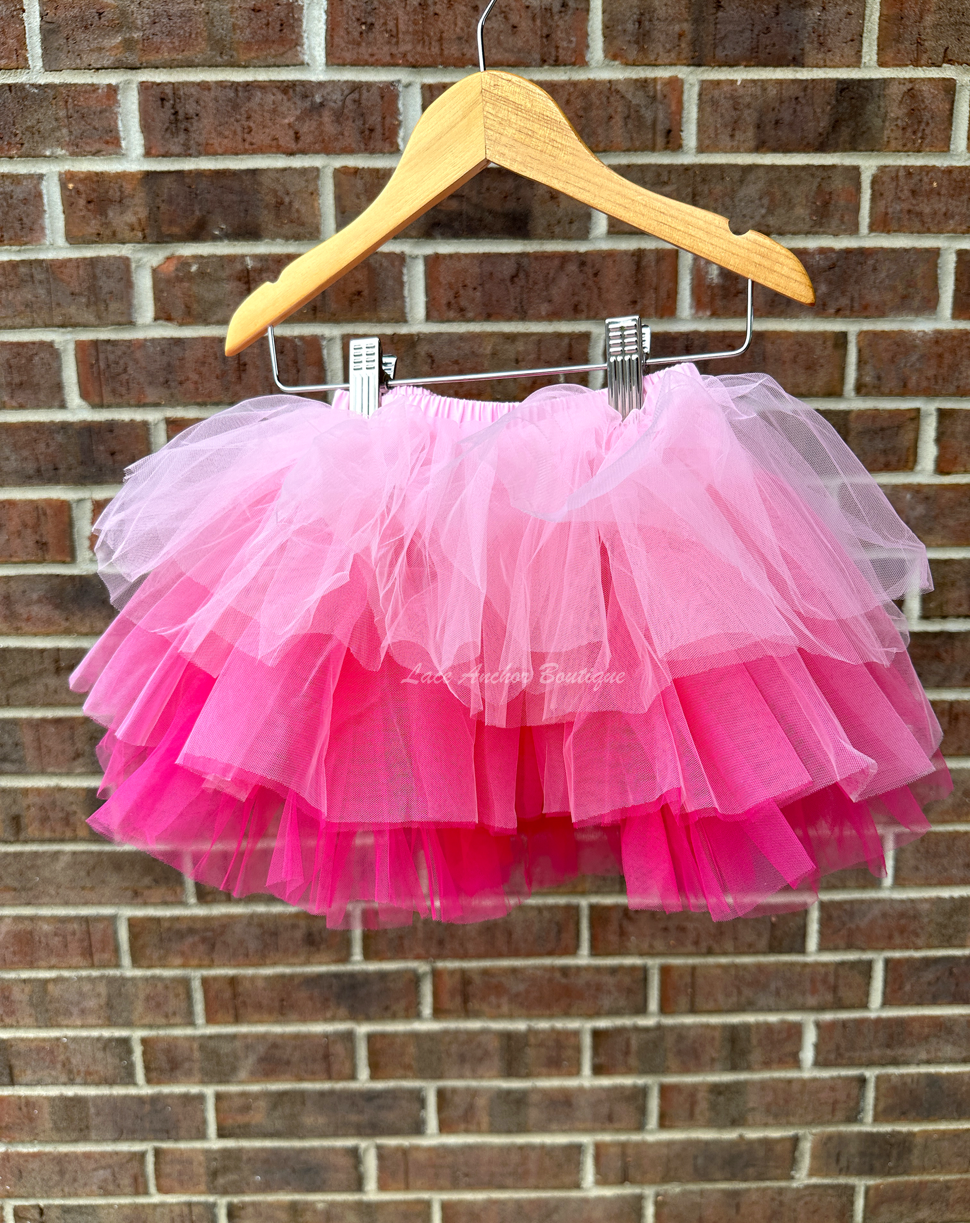 three colored pink tulle tutu with layers of ruffles