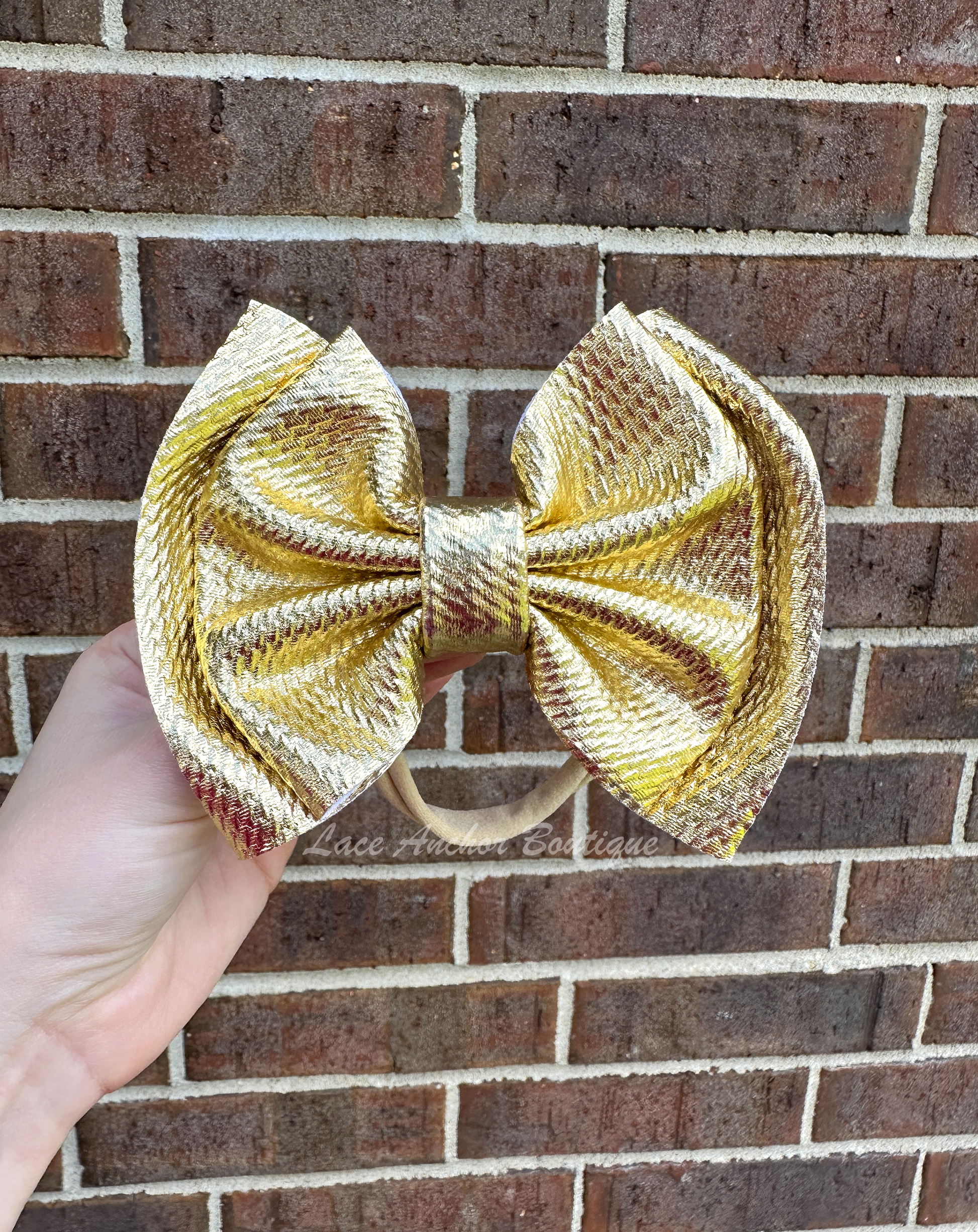 gold shiny glitter mega jumbo sized hair bow wraps for baby on nylon band