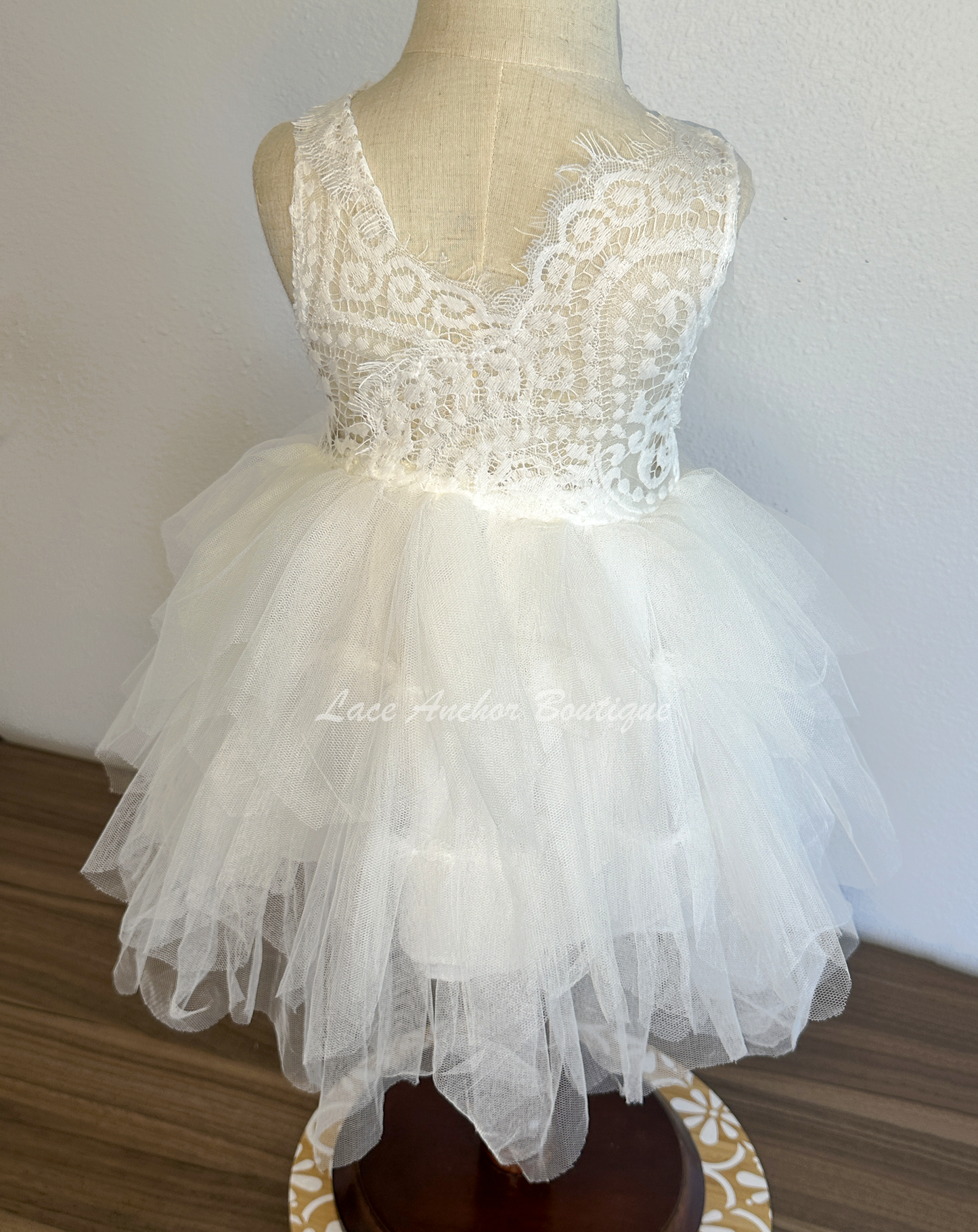 white girls dress with embroidered floral applique in silver with pearls and silver sequin butterflies