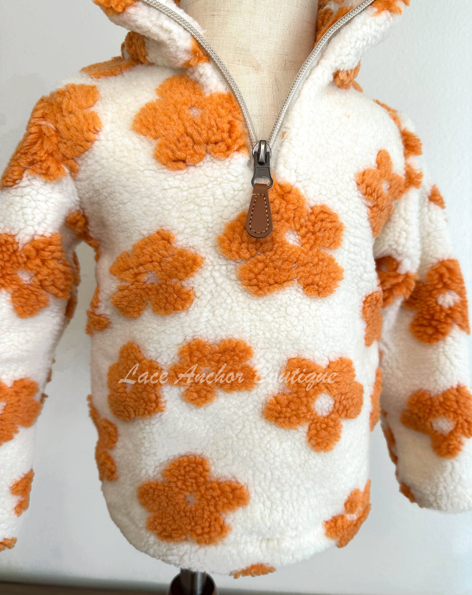 ivory sherpa quarter zip pullover with warm rust orange flowers all over