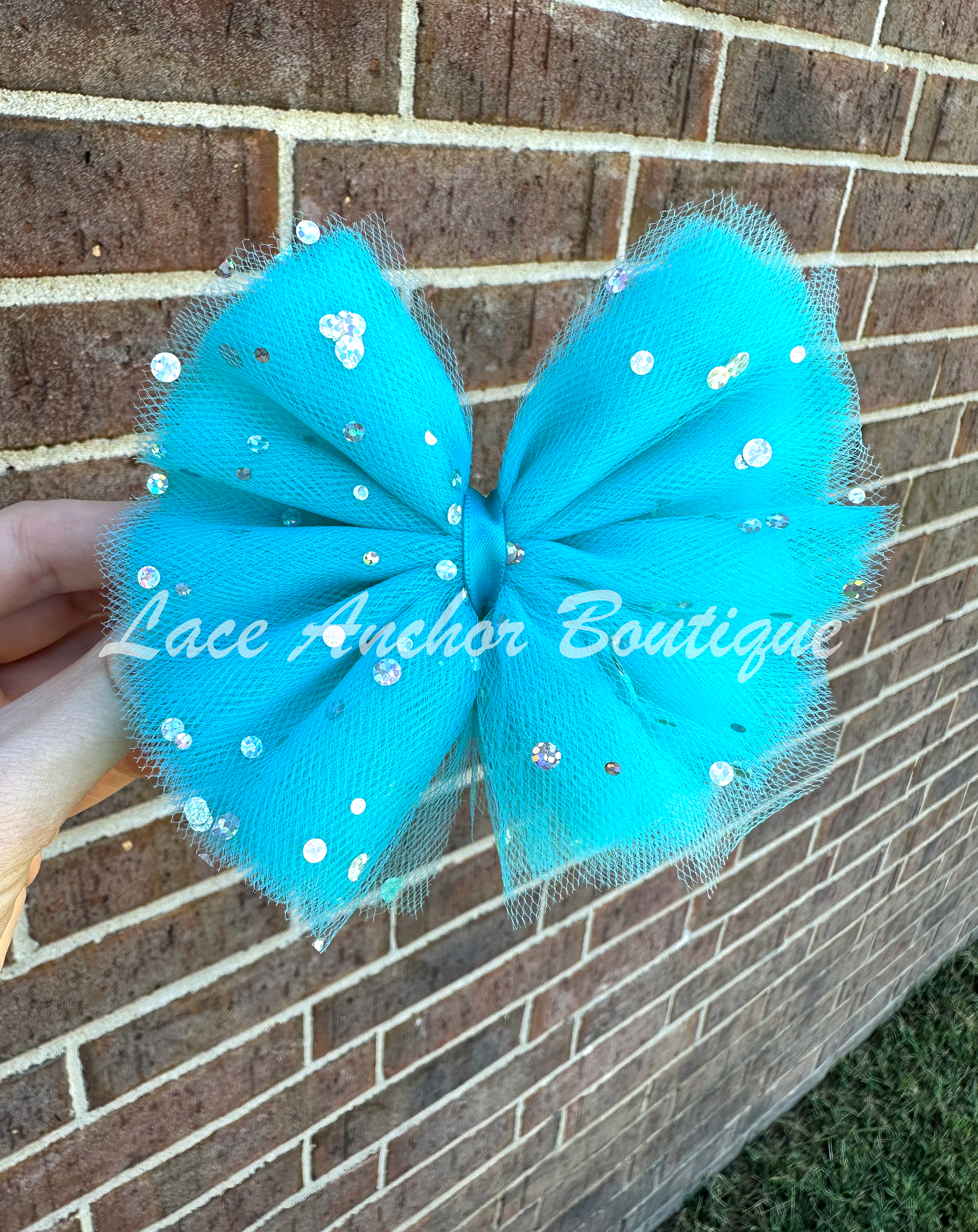 handmade custom tulle girls hair bow clips with silver sequin sparkles and glitter in teal light blue
