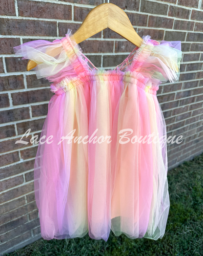 Peachy rainbow fairy peach, lilac purple, coral, pale yellow knee length tulle dress with iridescent butterfly wings attached for toddlers, babies, kids.