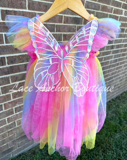 Neon rainbow fairy pink, blue, yellow, knee length tulle dress with iridescent butterfly wings attached for toddlers, babies, kids.