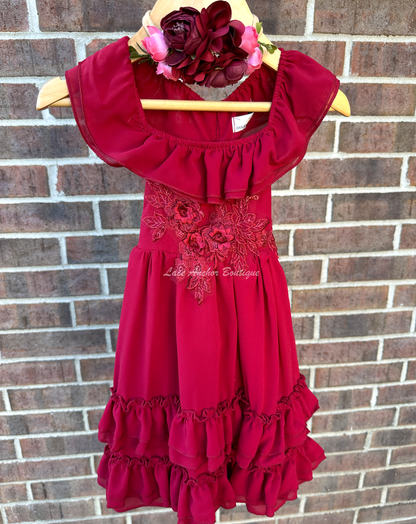 solid deep red ruffled layer dress with floral embroidered applique. Holiday sleeveless maxi dress.