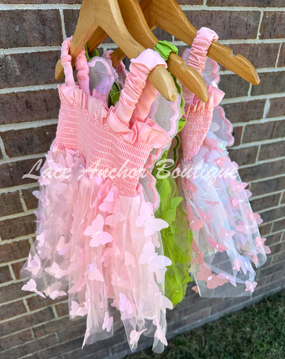 Girls butterfly wing dresses in pink, rainbow, and green. Attached fairy wings toddler baby dress.