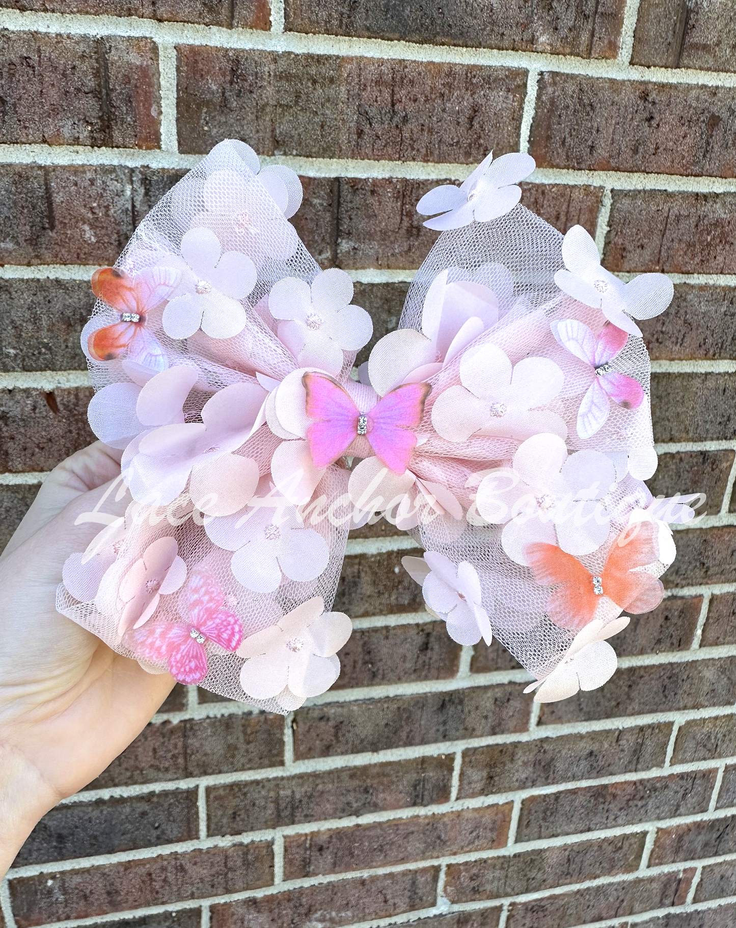 light blush pink tulle sailor style girls hair bow with butterflies