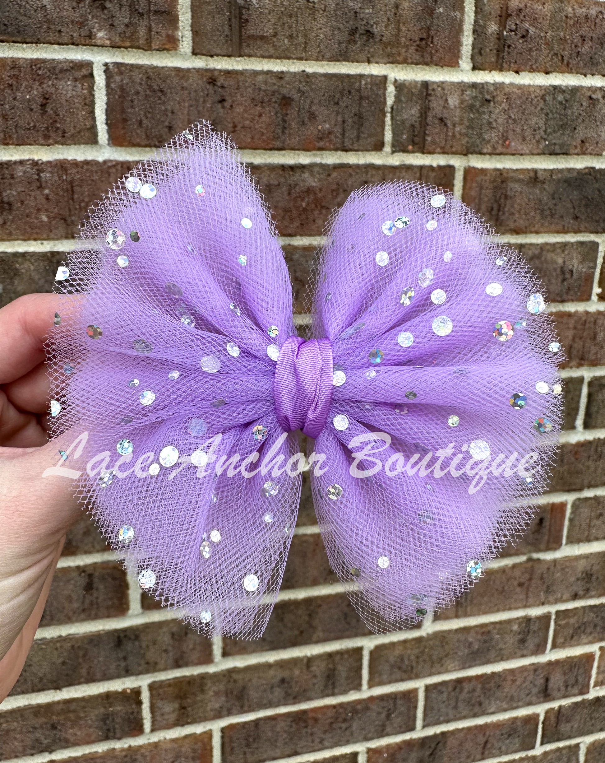 handmade custom tulle girls hair bow clips with silver sequin sparkles and glitter in lilac light purple.