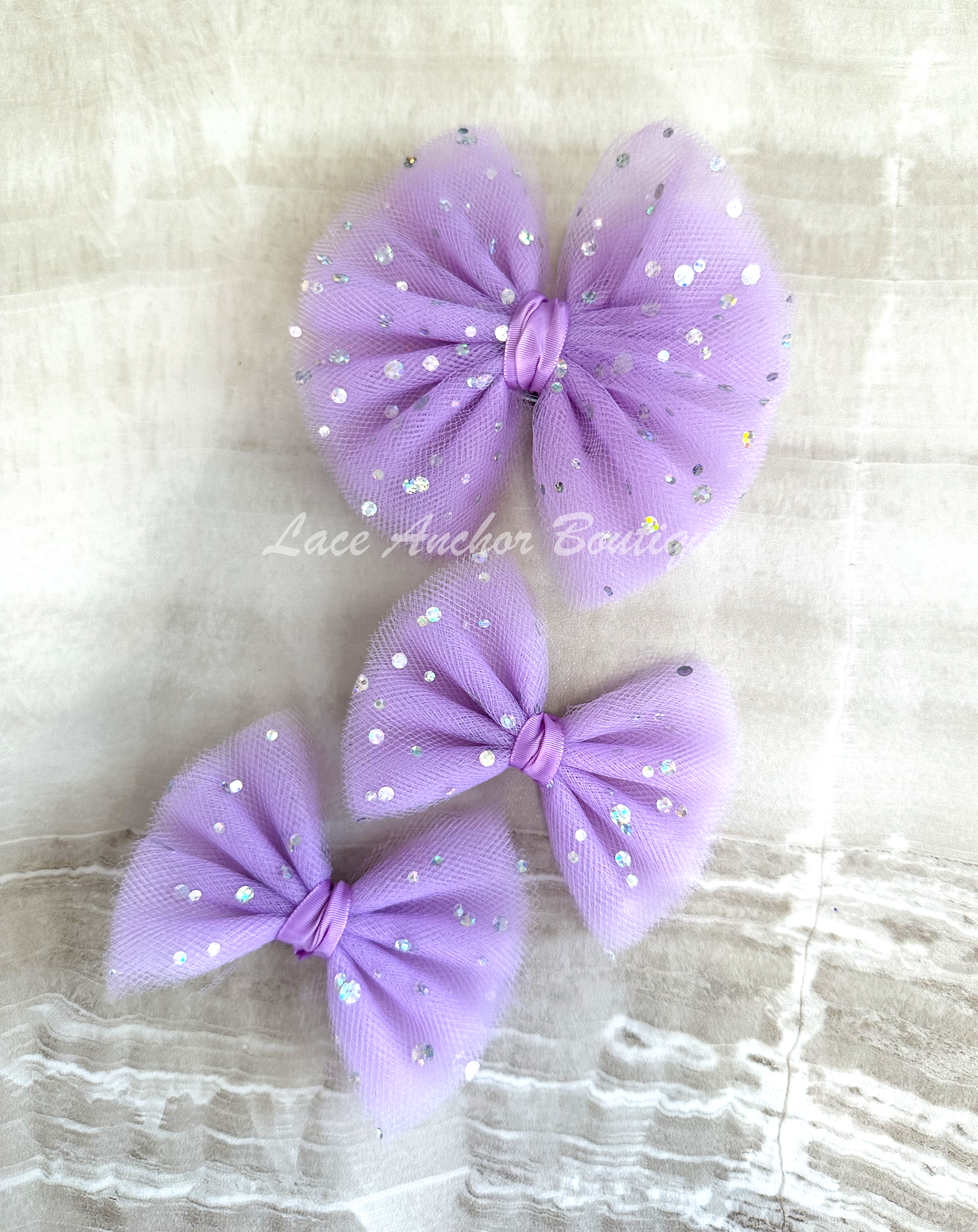 handmade custom tulle girls hair bow piggie clips with silver squin sparkles and glitter in lilac light purple.
