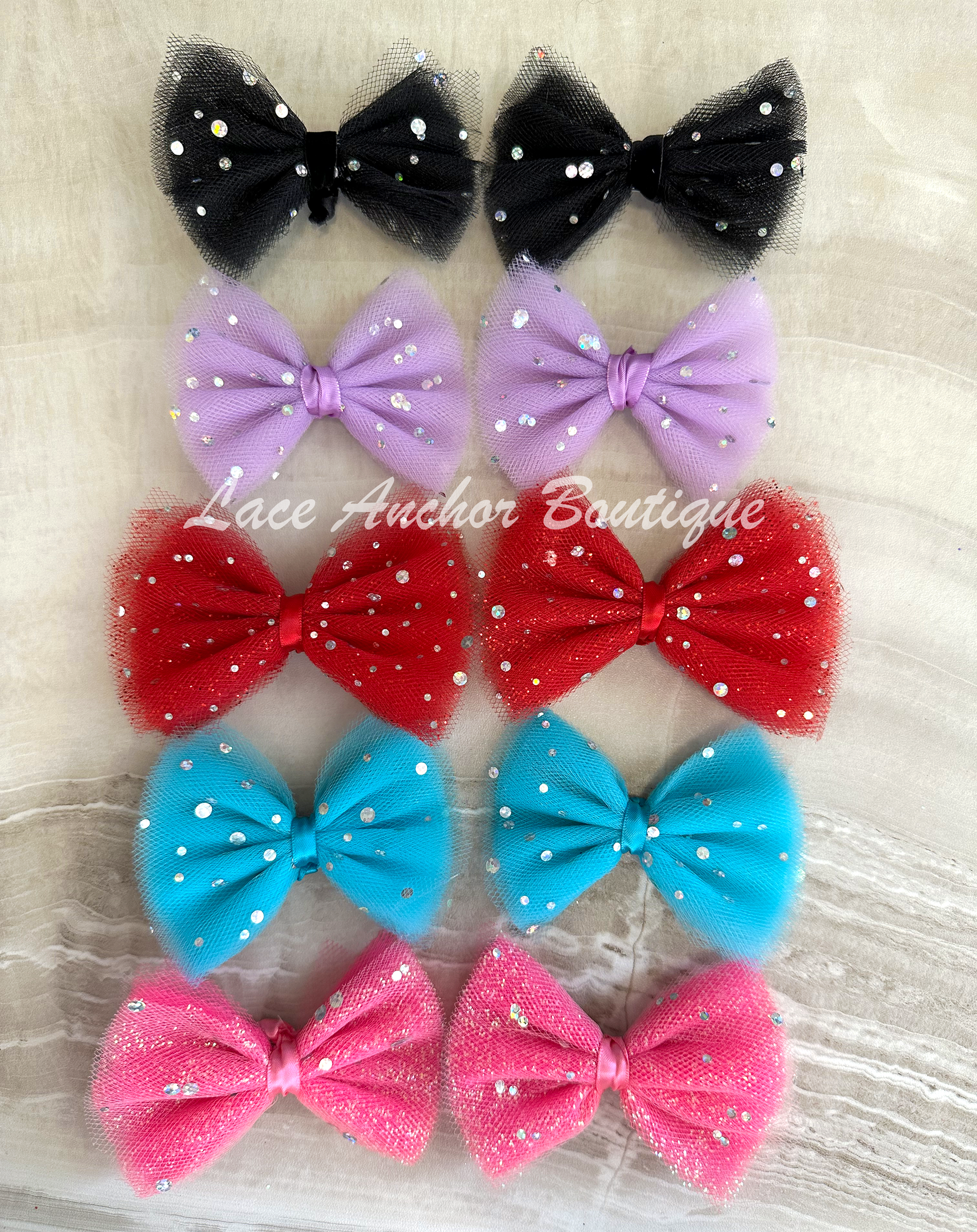 handmade custom tulle girls hair bow clips with silver sequin sparkles and glitter.
