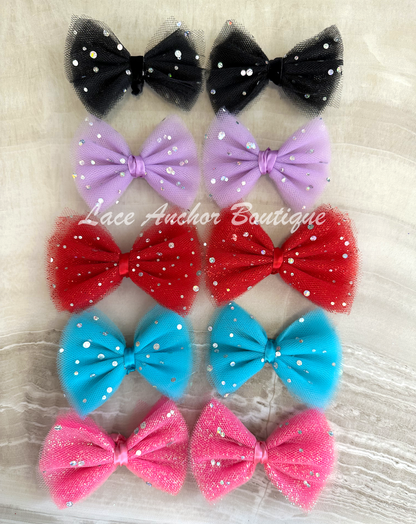 handmade custom tulle girls hair bow clips with silver sequin sparkles and glitter.