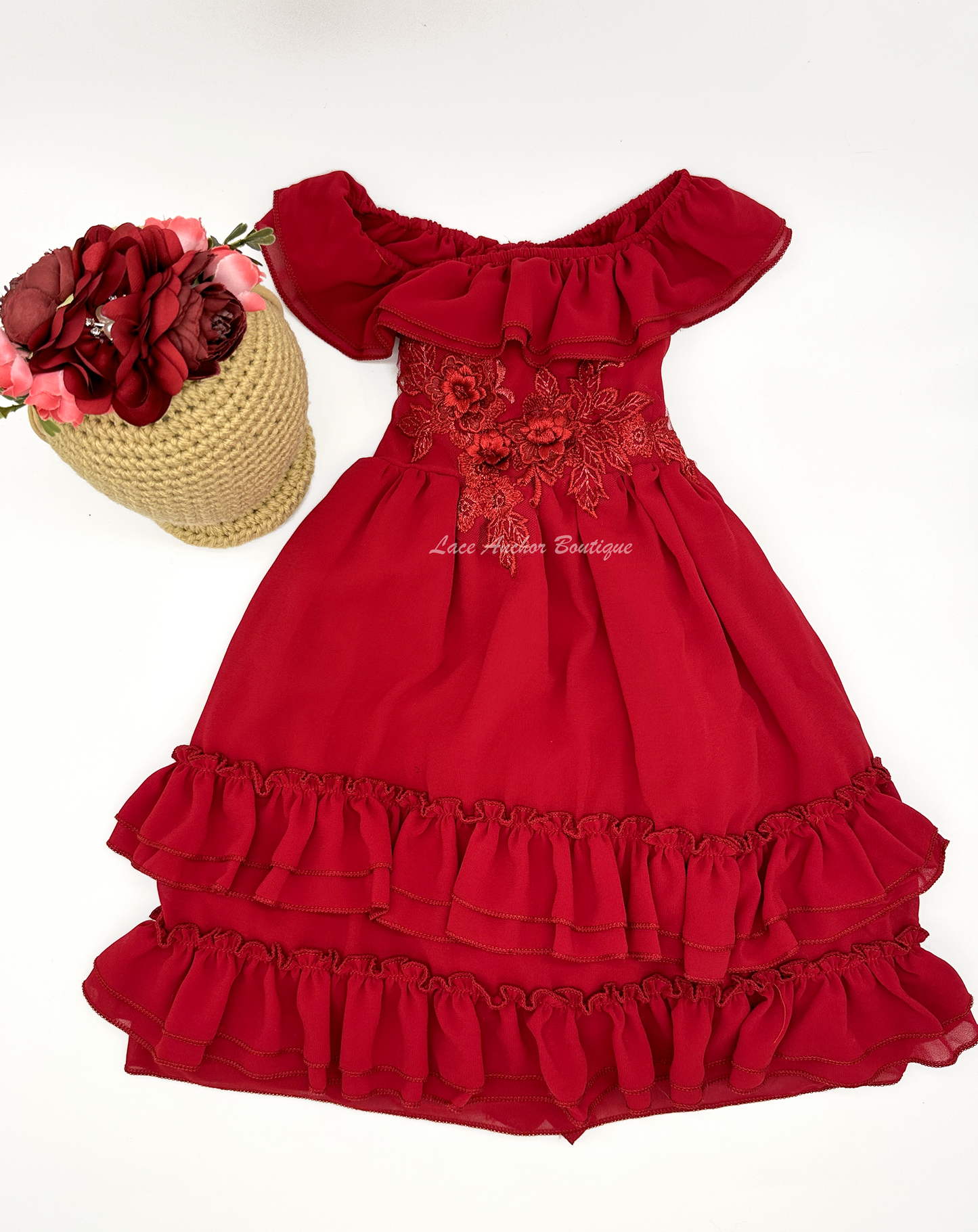 solid deep red ruffled layer dress with floral embroidered applique. Holiday sleeveless maxi dress.